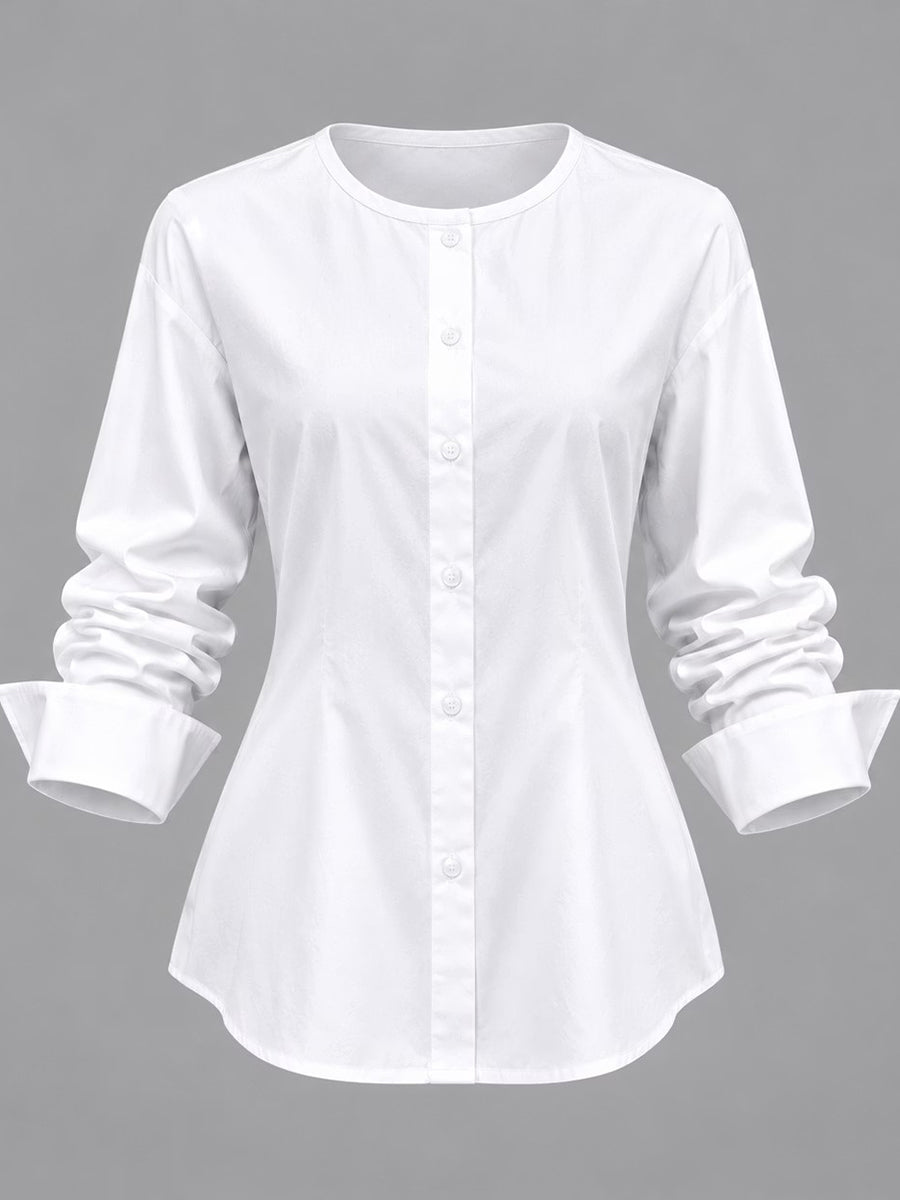 The white shirt from the set with wide folded cuffs