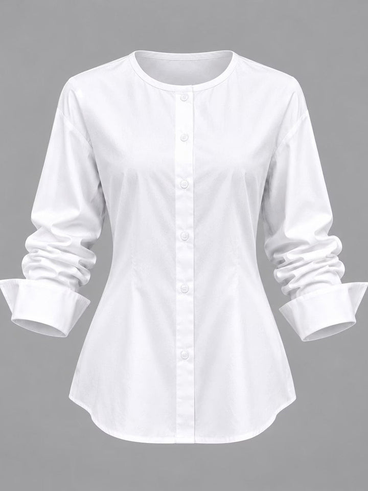 The white shirt from the set with wide folded cuffs