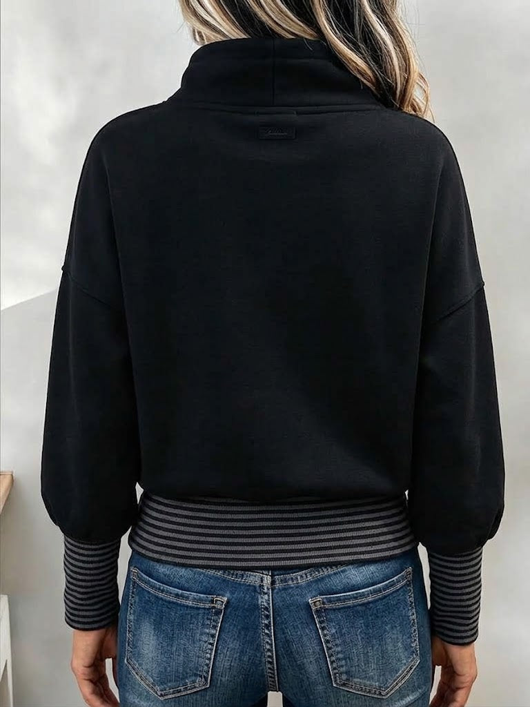 Back view of the black sweatshirt with striped cuffs and waistband