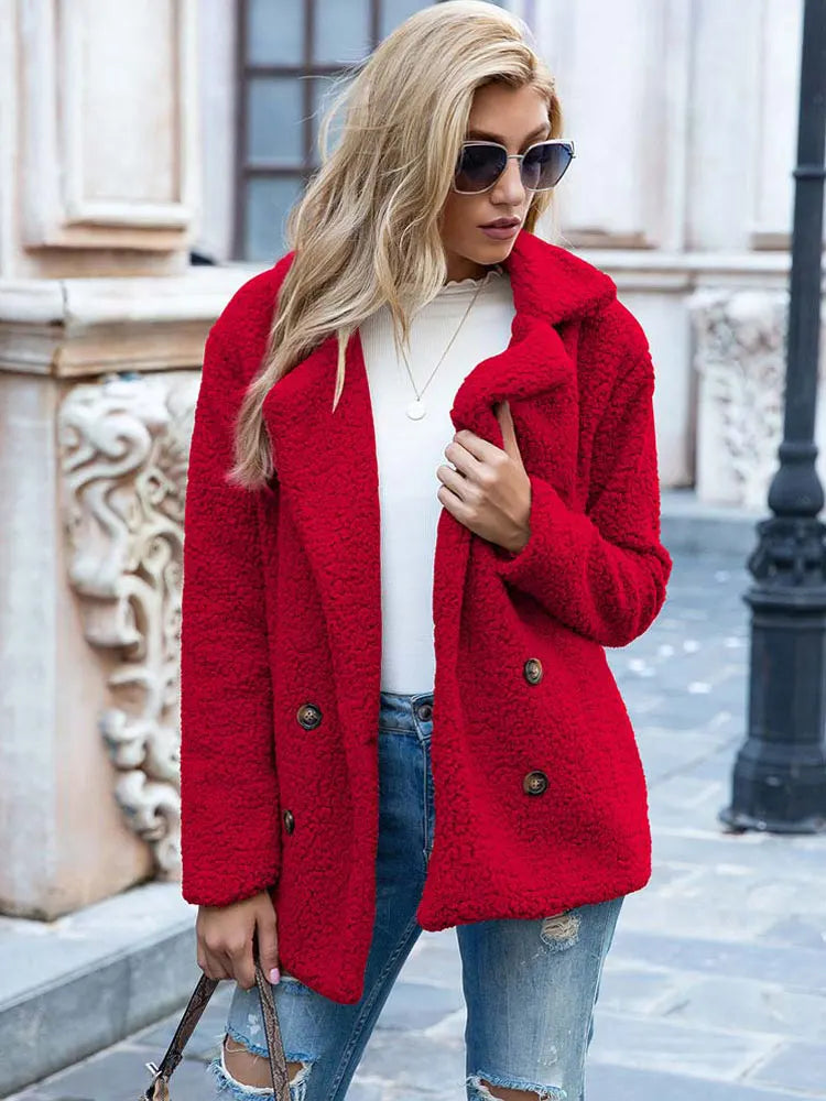 Red teddy coat with lapels and double breasted buttons on a model outdoors