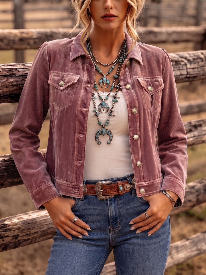 Dusty rose velvet-look jacket styled with turquoise jewelry at a wooden ranch fence