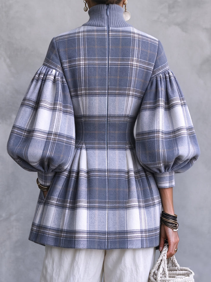 Back view of the plaid tunic with cinched waist and peplum hem