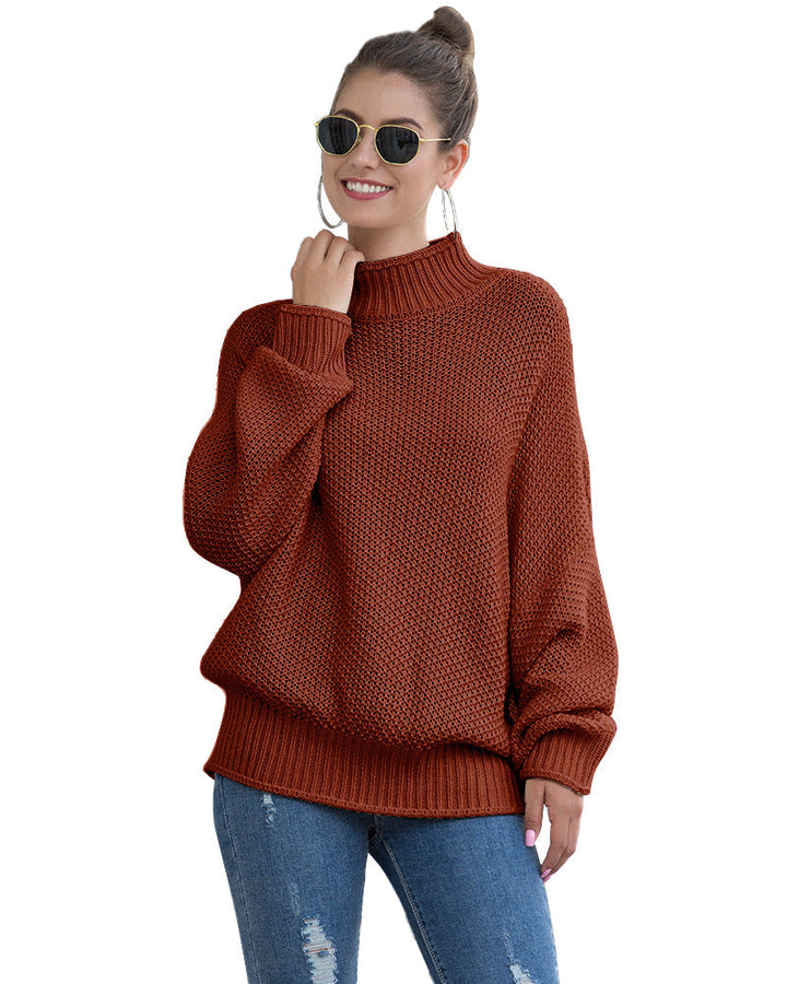 Rust turtleneck sweater worn with a hair bun
