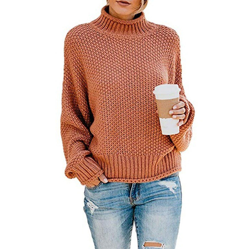 Terracotta chunky turtleneck held with a coffee cup
