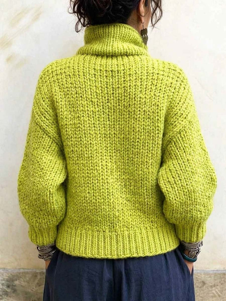 Back of the lime chunky knit sweater with tall collar and ribbed hem