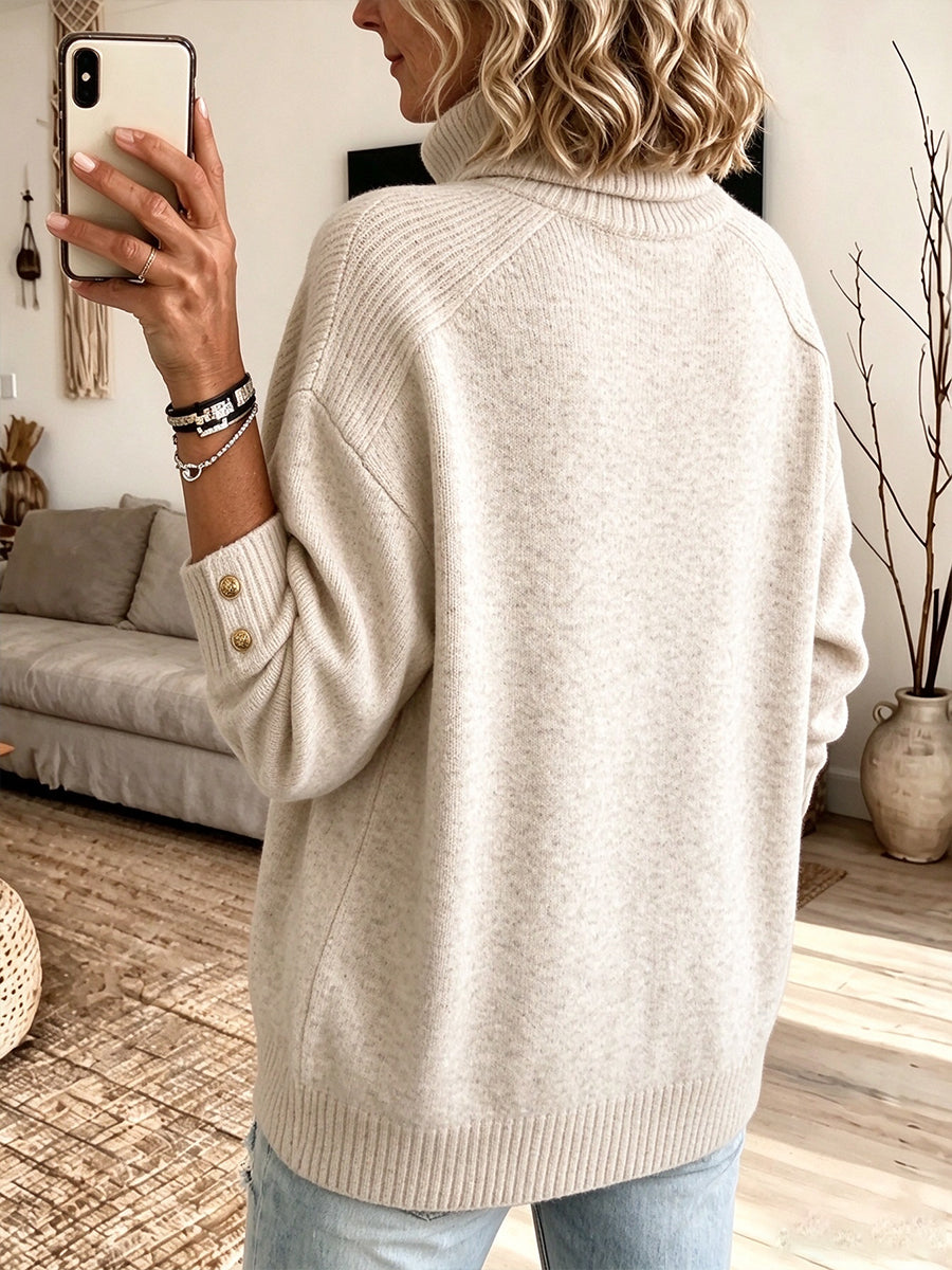 Back view of the oatmeal sweater with shoulder seam and ribbed hem