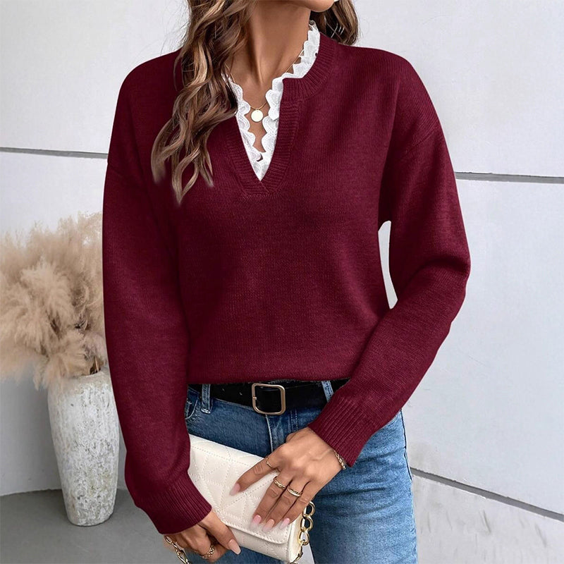 Burgundy lace trim V neck sweater styled with jeans and a cream clutch