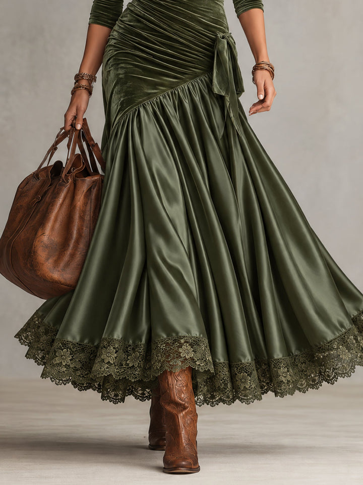 Olive satin-look maxi skirt with lace trim hem, worn with brown boots
