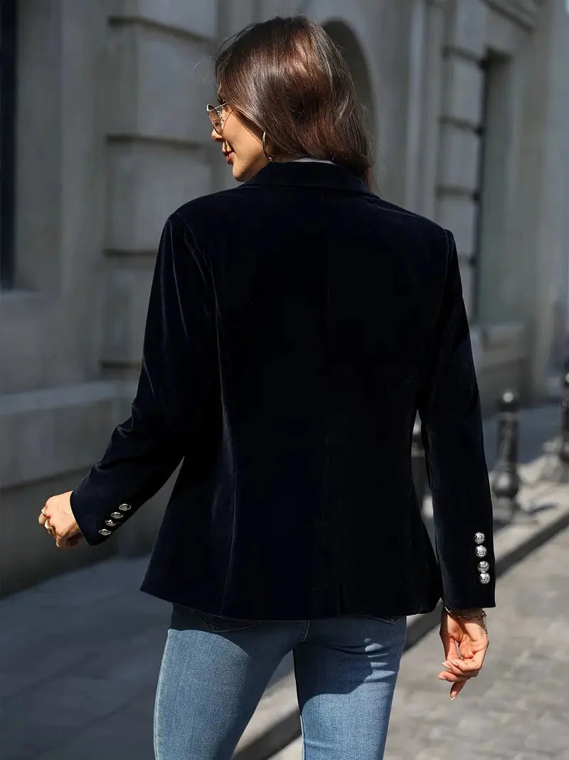 Back view of the black velvet-look blazer with gold-tone cuff buttons