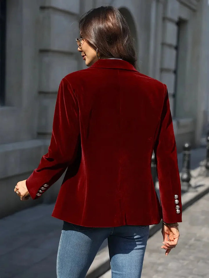 Back view of the red velvet-look blazer with button cuffs
