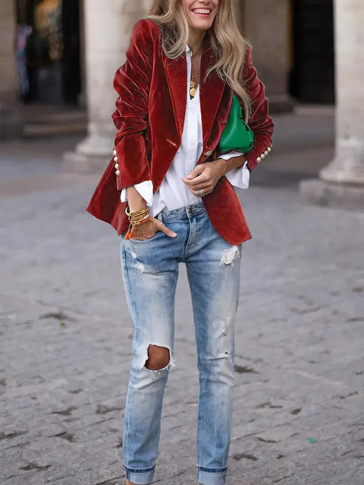 Red velvet-look blazer worn with a white shirt and light denim