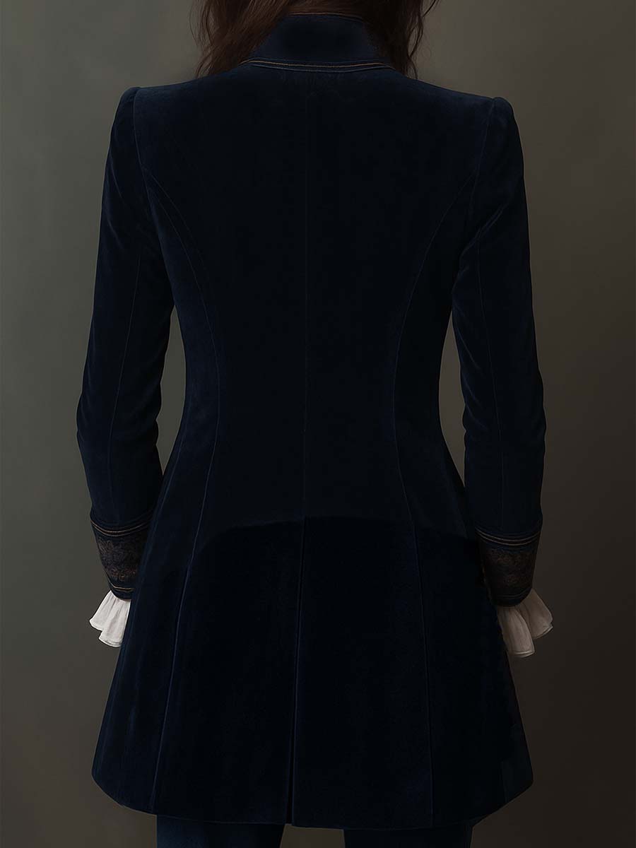 Back view of the navy velvet-look long jacket with a flared hem