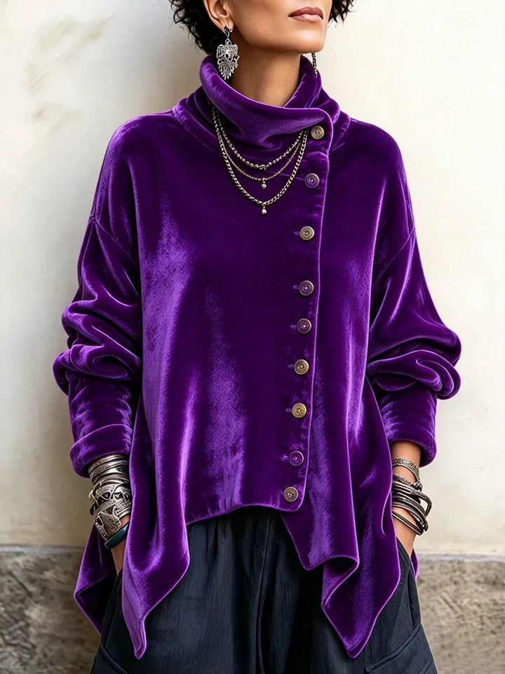 Purple velvet-look turtleneck top with off-center button placket and pointed hem