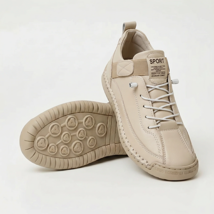 Beige walking shoes with elastic laces and wide toe, shown with the sole