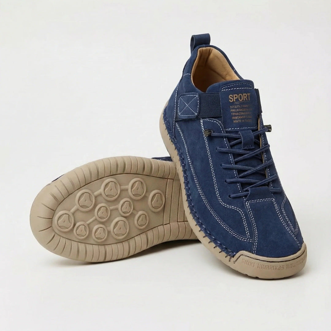 Women's walking shoes in navy, wide toe stitched style with elastic laces, shown with sole
