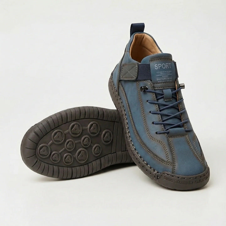 Steel blue walking shoes with elastic laces and visible stitching, shown with sole
