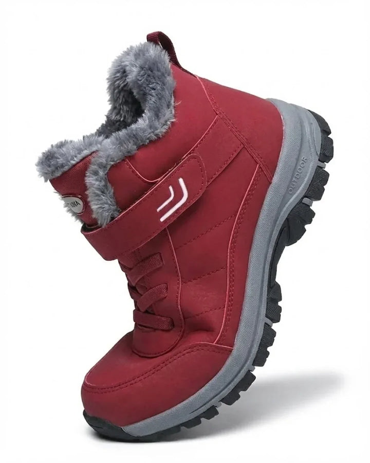Red hiking style ankle boot with hook-and-loop strap, angled side view