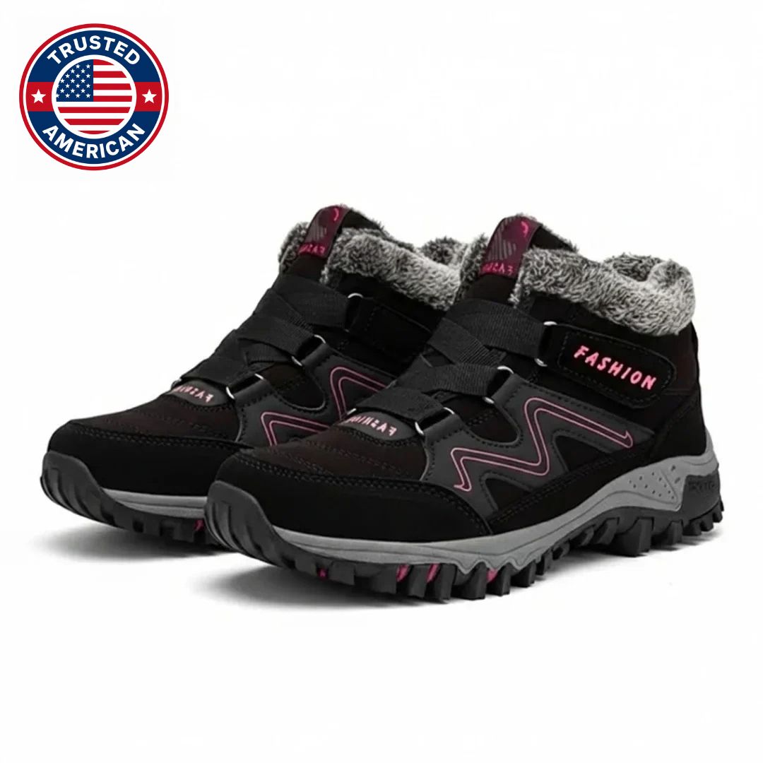 Black boots with pink accents and fur collar, side pair view