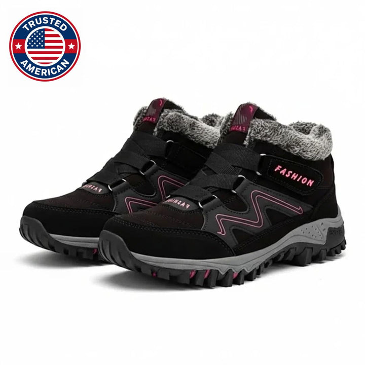 Black boots with pink accents and fur collar, side pair view
