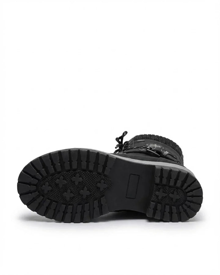 Black boot turned to show the deep lug tread on the sole