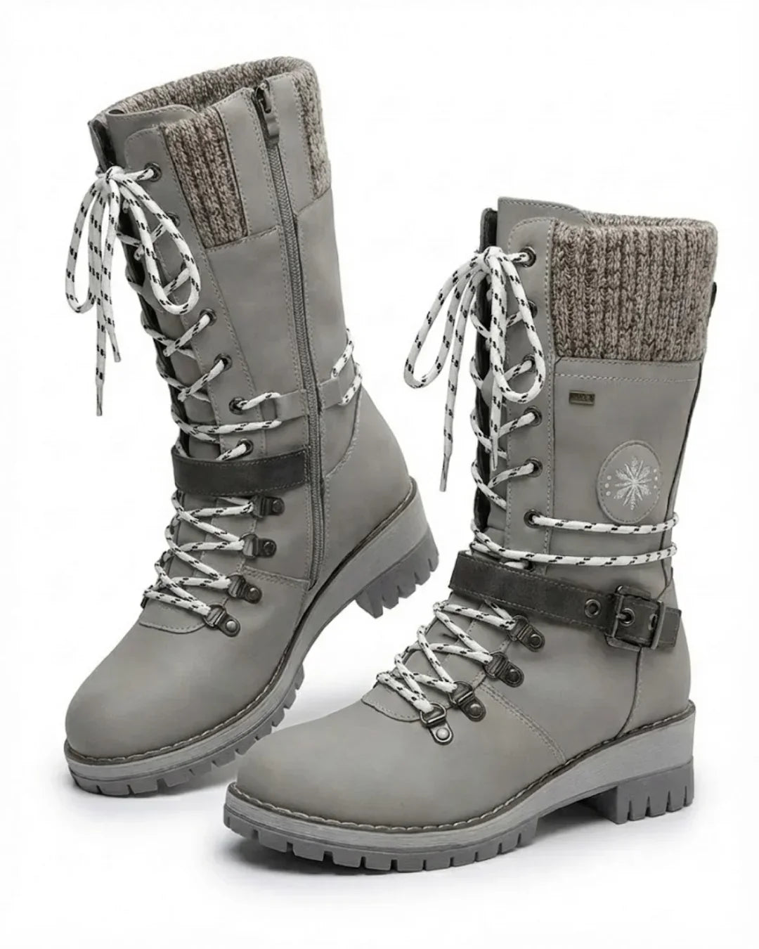 Pair of gray lace up hiking boots with knit cuff and buckle strap