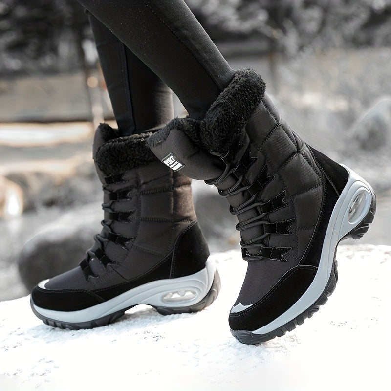 Black lace up platform boots worn while walking on snow