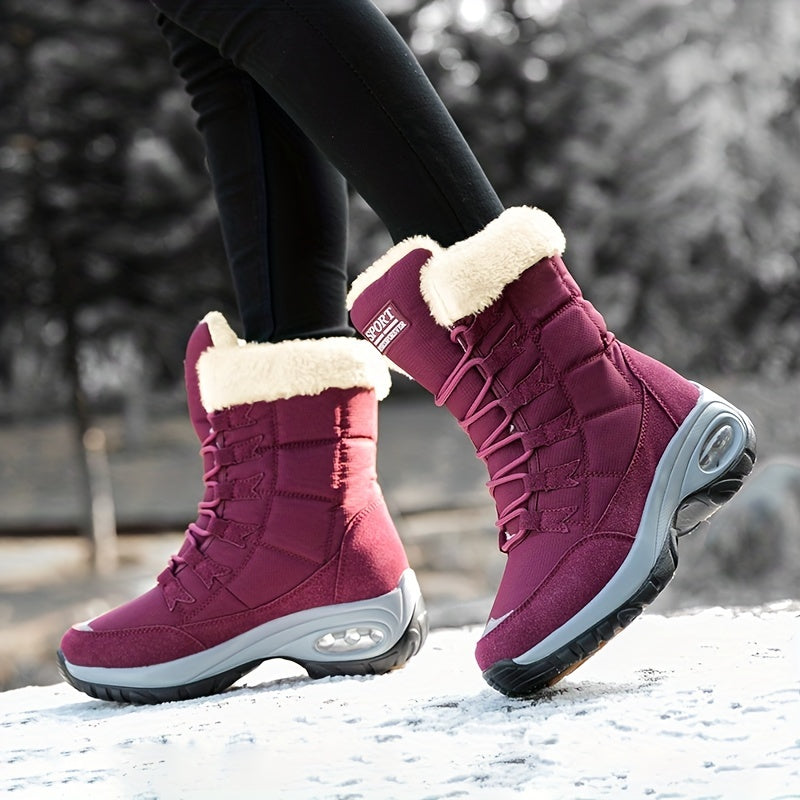 Burgundy mid calf boots in motion, shown from the side on snow