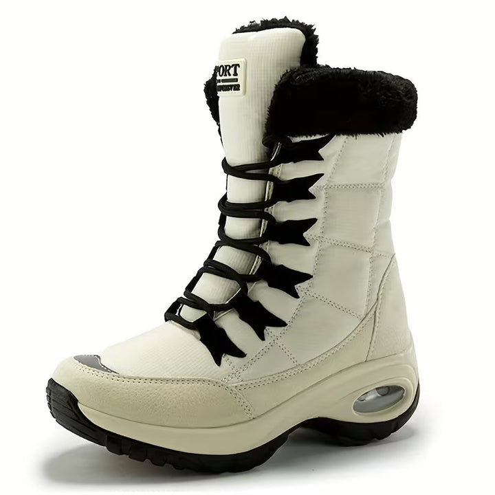 Cream lace up mid calf boot with black laces, plush collar and platform sole
