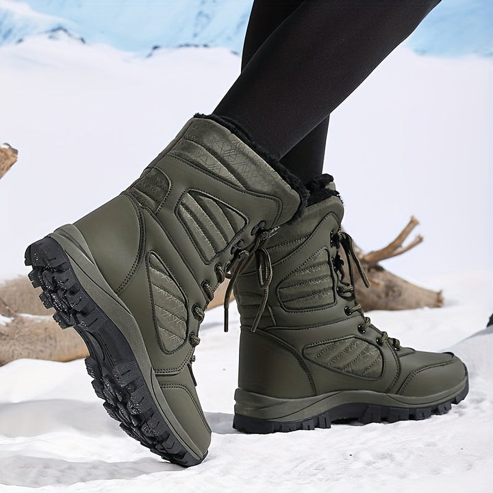 Olive mid calf boot seen from the side with laces and tread sole