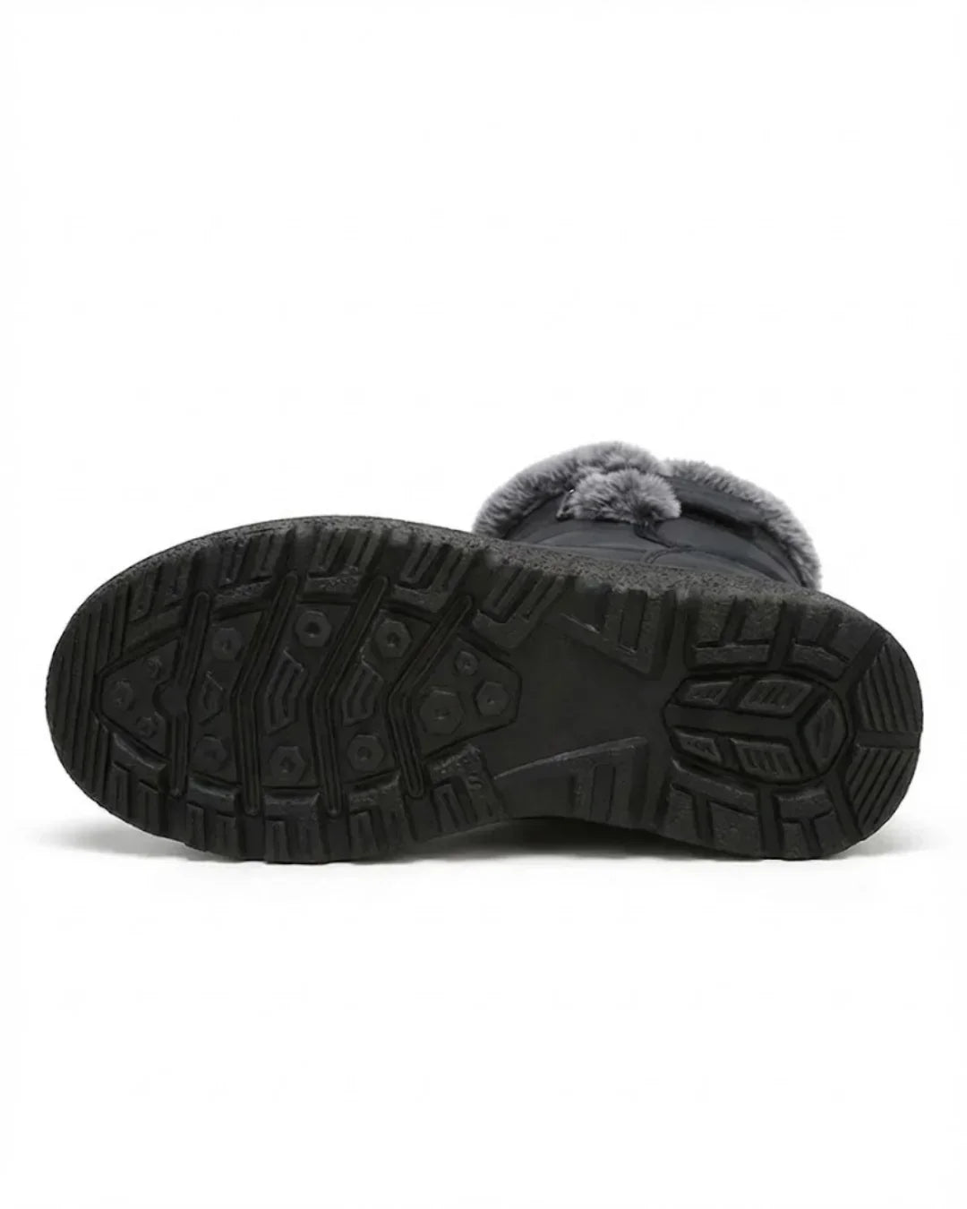 Underside of the black boot showing the deep treaded rubber sole