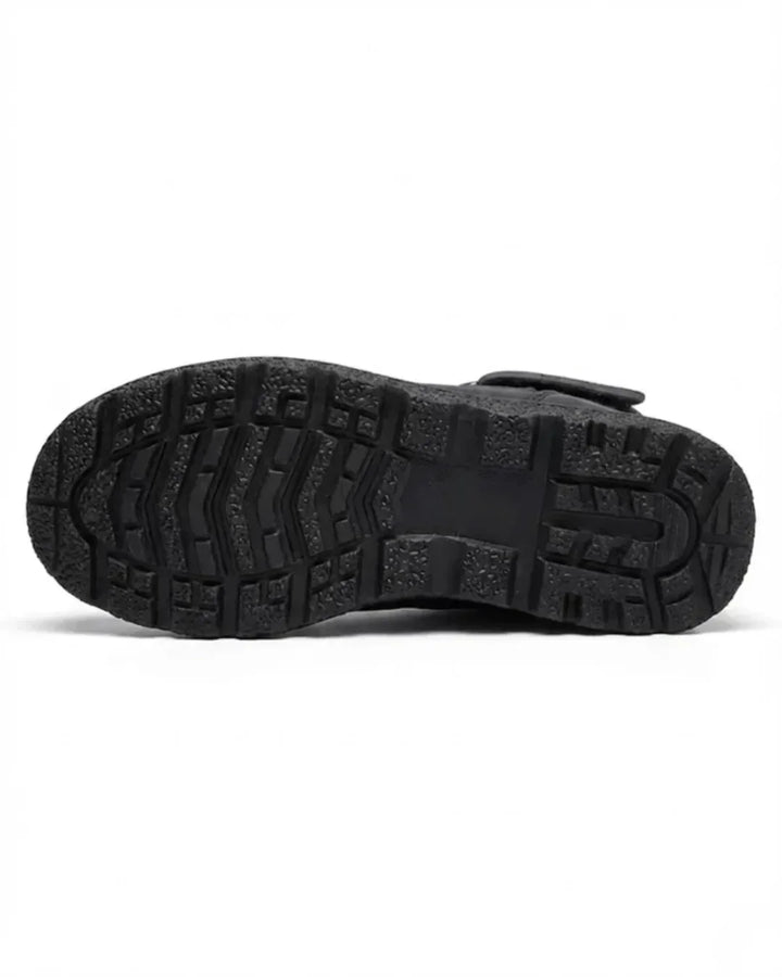 Tread sole of the black quilted mid calf boot
