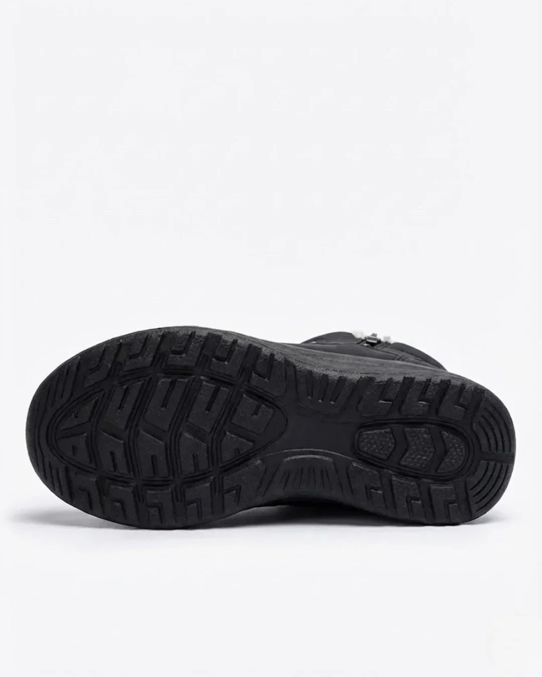 Sole view of the black quilted ankle boot with deep tread