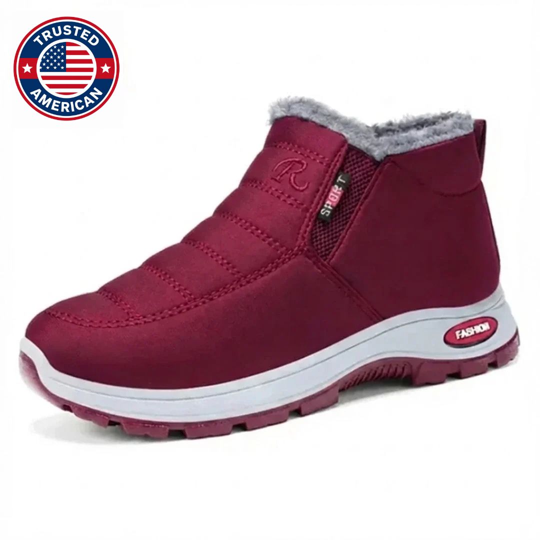 Burgundy quilted slip on ankle boot with faux fur collar, angled side view