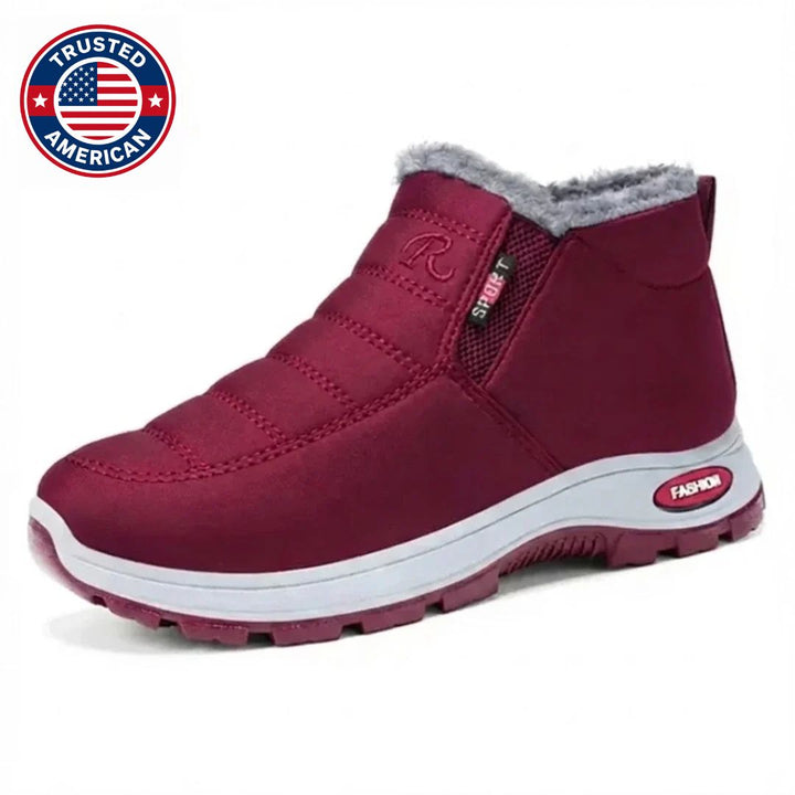 Burgundy quilted slip on ankle boot with faux fur collar, angled side view