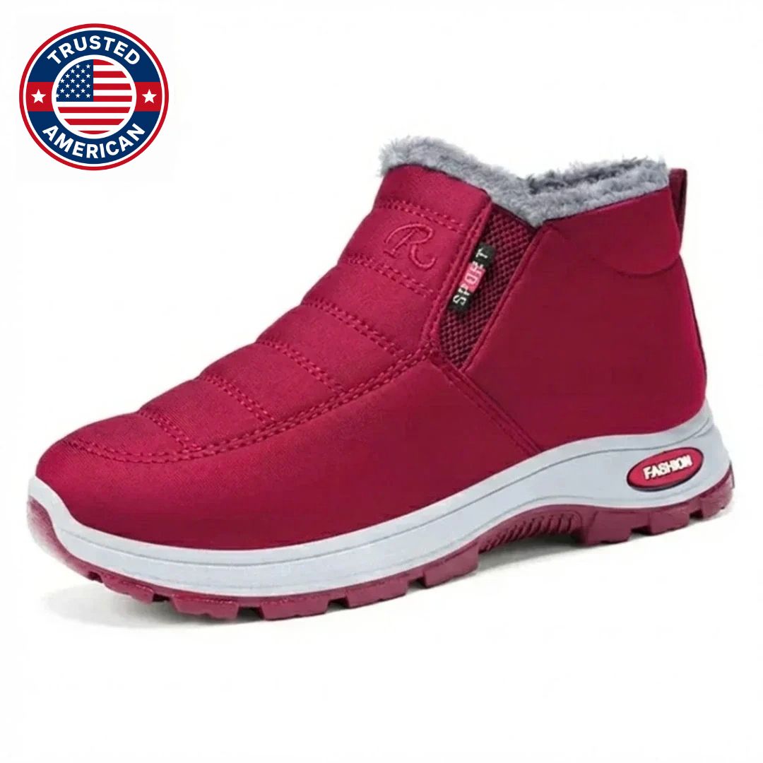 Red quilted slip on boot with faux fur collar and white sole, side view