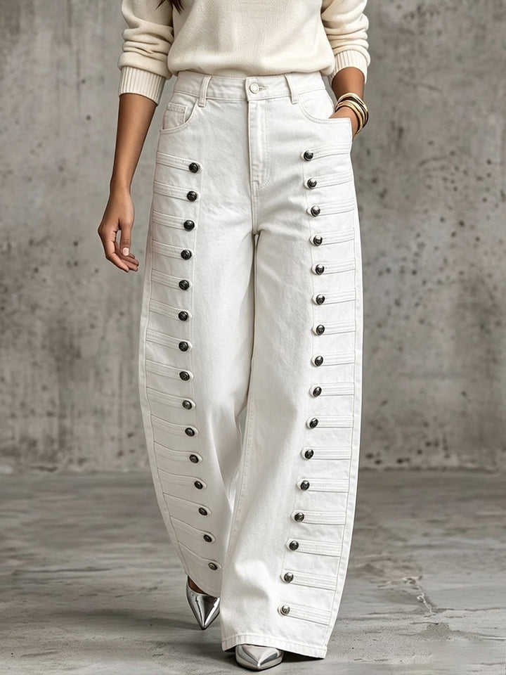 White wide leg pants with two rows of metal buttons on each leg