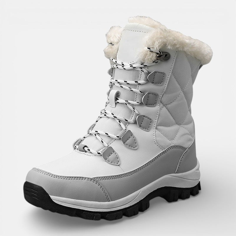White quilted lace up winter boots with faux fur collar