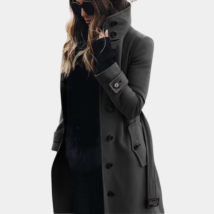 Long belted funnel neck coat in charcoal gray worn with a black top