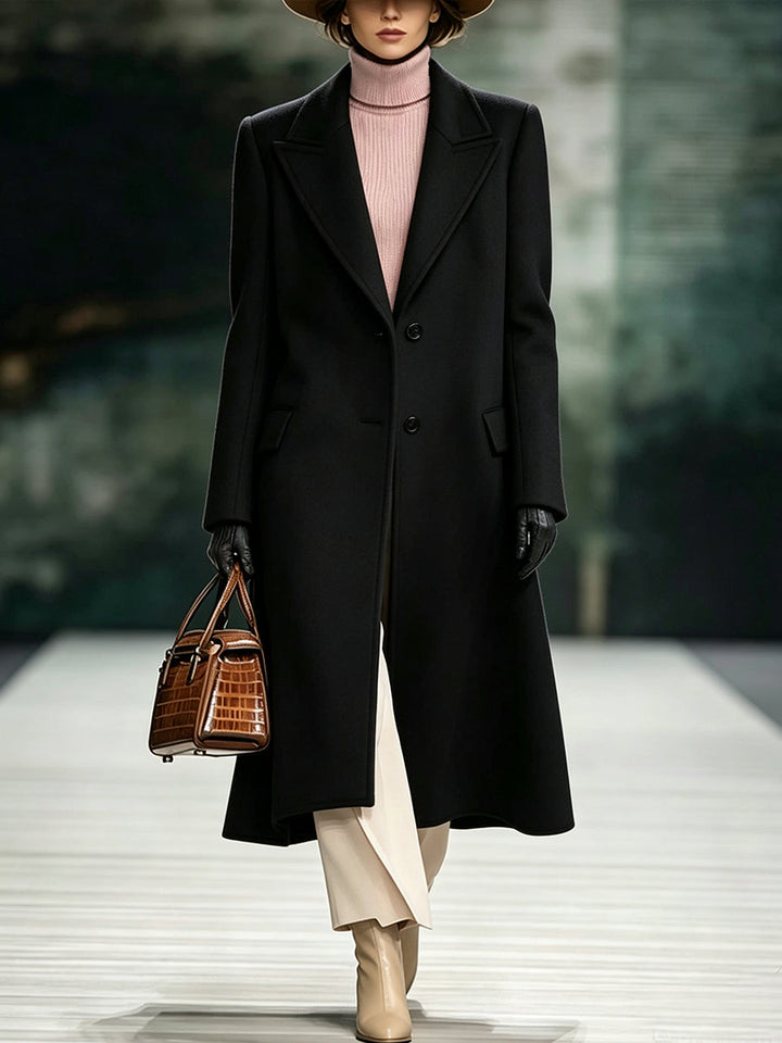 Black long coat with notched lapels and slim side pockets