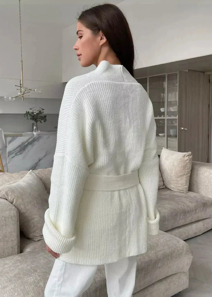 Ivory oversized cardigan seen from behind with the belt tied