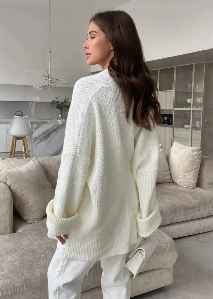 Back view of the ivory sweater coat with dropped shoulders