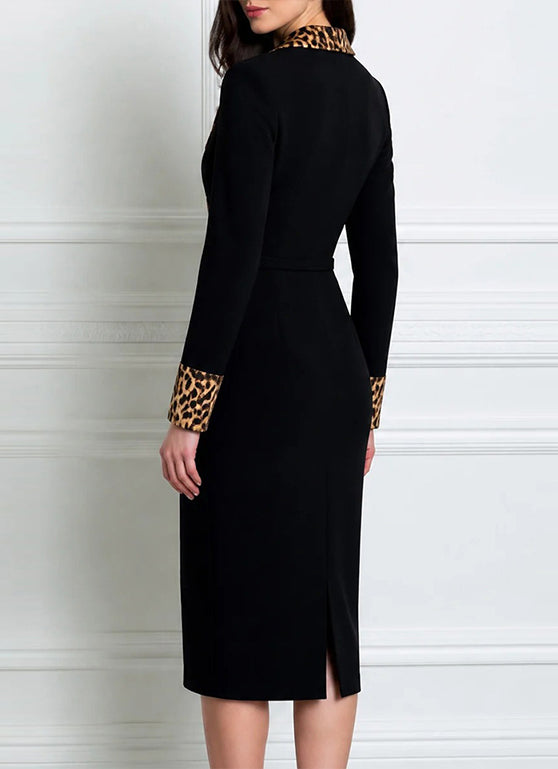 Back of the black wrap dress showing the leopard cuffs and back slit