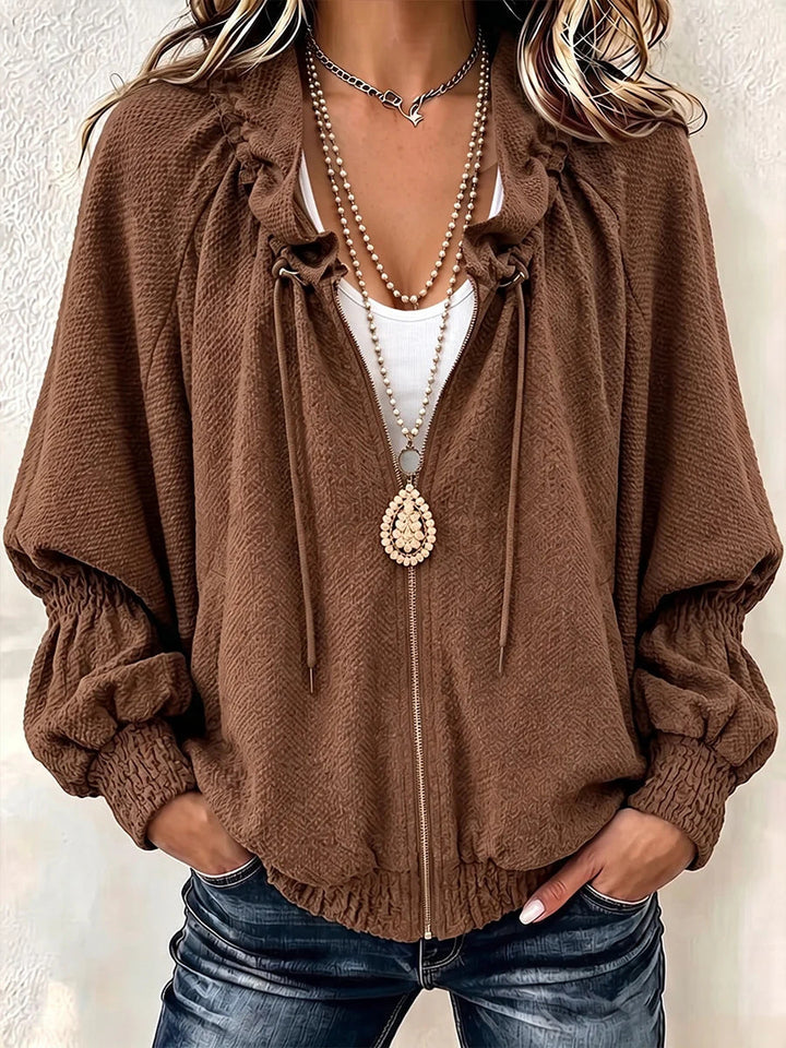 Brown textured knit jacket with roomy sleeves and soft blouson shape